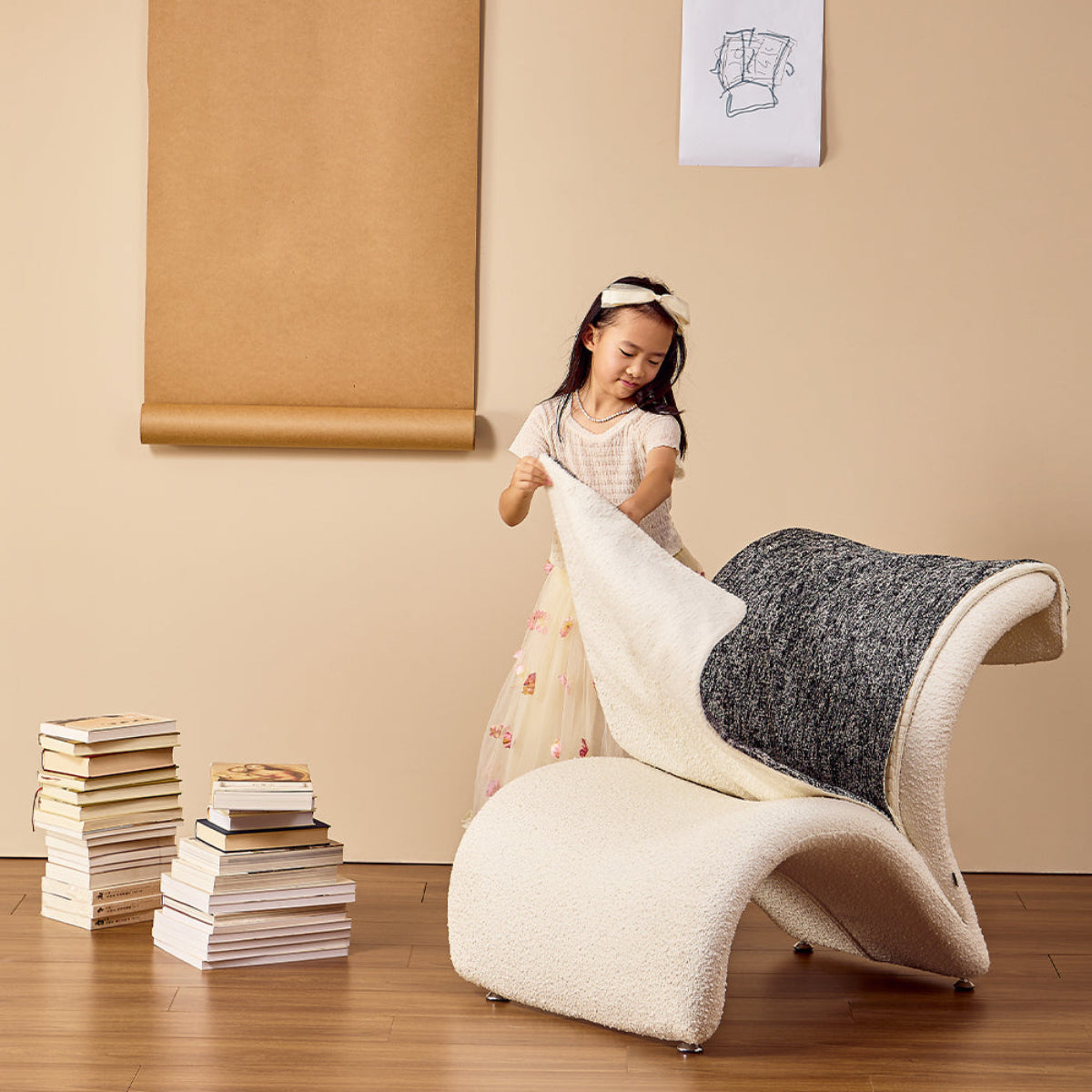 Child playing with a modern, wavy chair in a room with a beige wall and wooden floor.