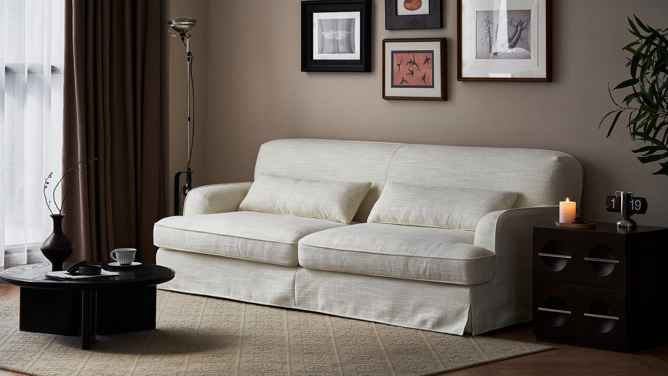 Beige sofa in a living room with decor elements.