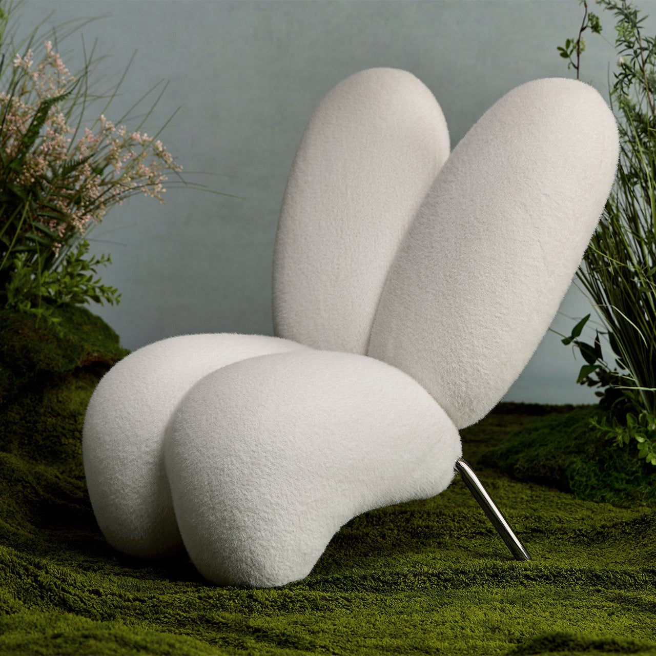 Modern white chair with organic design in a natural setting